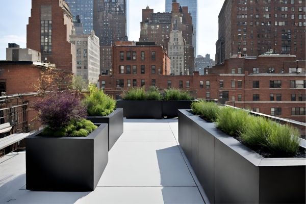 Durable fiberglass planters rest atop a rooftop garden.
